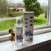 PawBright pet product bottle and packaging on a windowsill with a view of greenery outside.