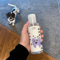 Hand holding a bottle labeled 'Pawbright'